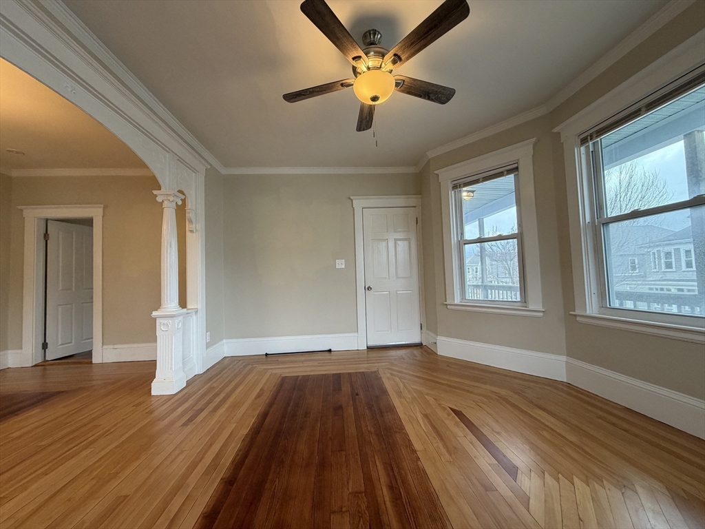 320 Wood Street, Unit 2 New Bedford, MA 02745 - Photo 2 of 23 wooden floor in an empty room with a window