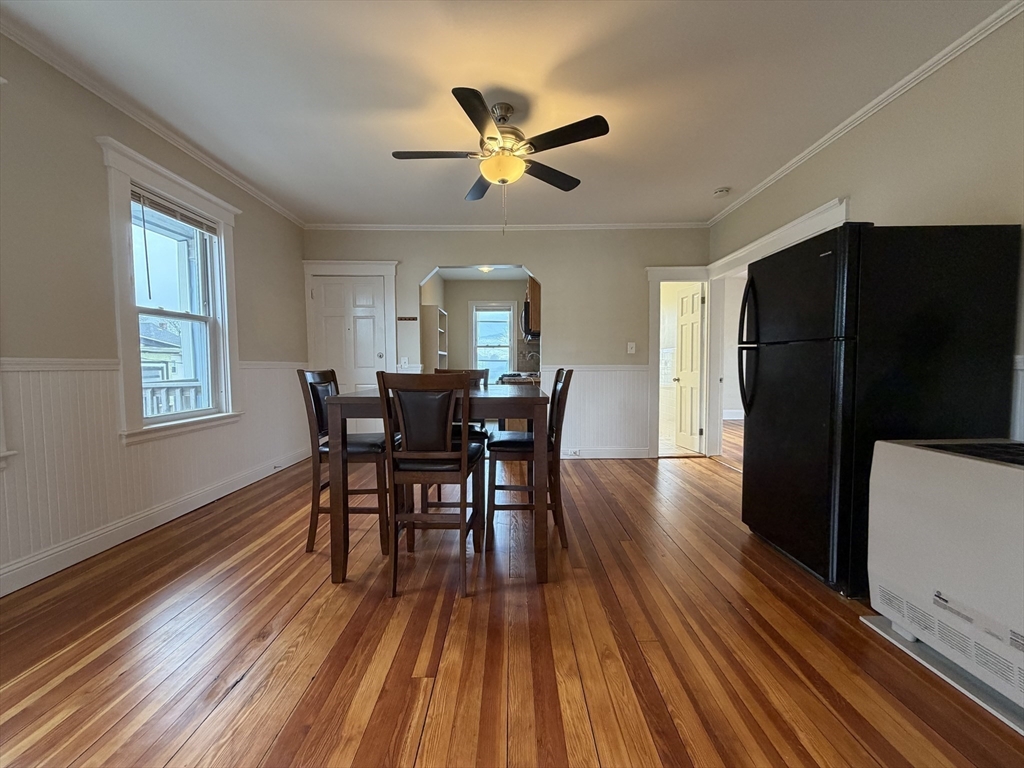 320 Wood Street, Unit 2 New Bedford, MA 02745 - Photo 8 of 23 a view of a dining room with furniture window and wooden floor