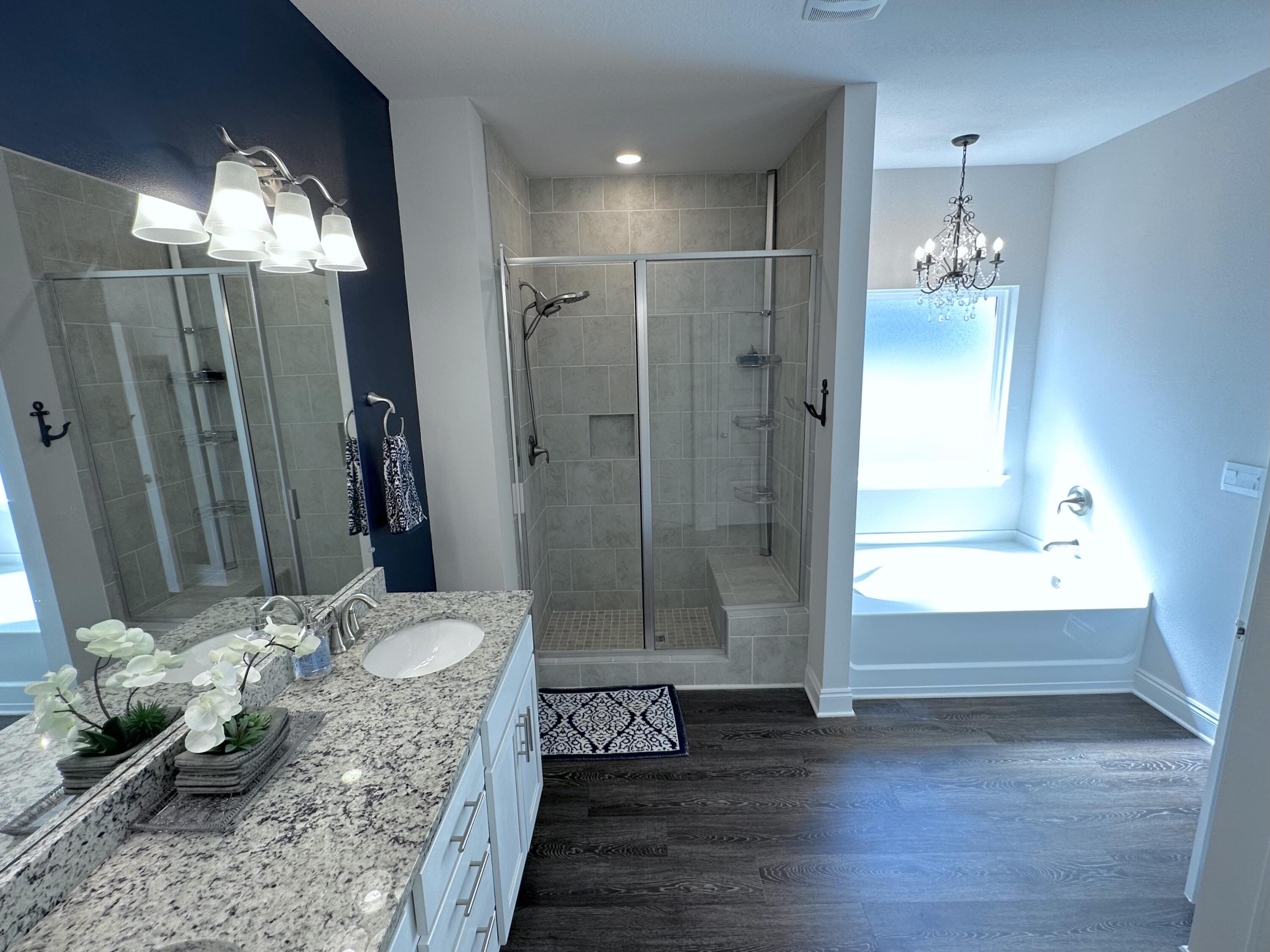 165 Martingale Loop Lynn Haven, FL 32444 - Photo 13 of 37 a bathroom with a granite countertop sink a toilet and shower