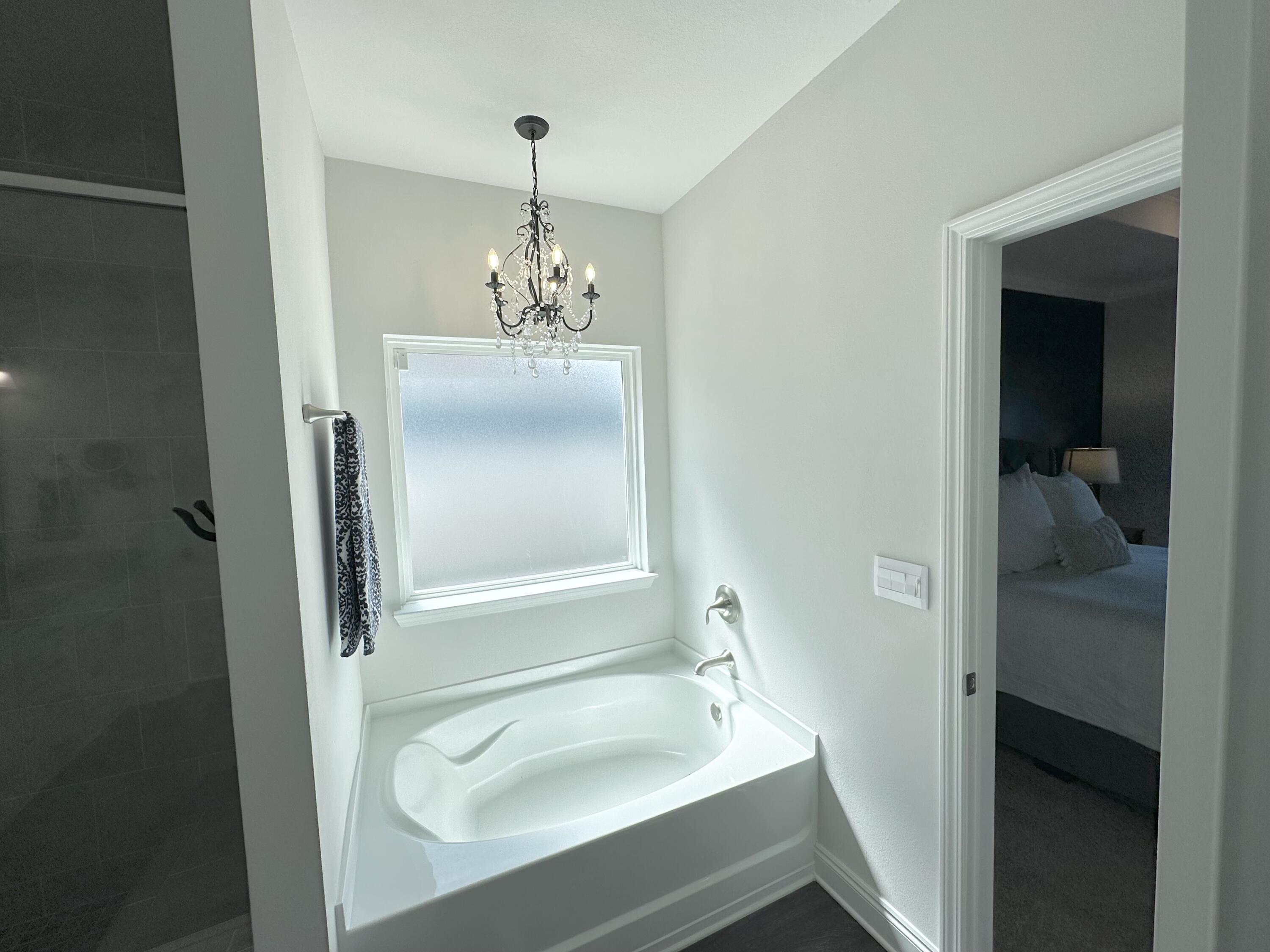 165 Martingale Loop Lynn Haven, FL 32444 - Photo 14 of 37 a bathroom with a sink and a mirror