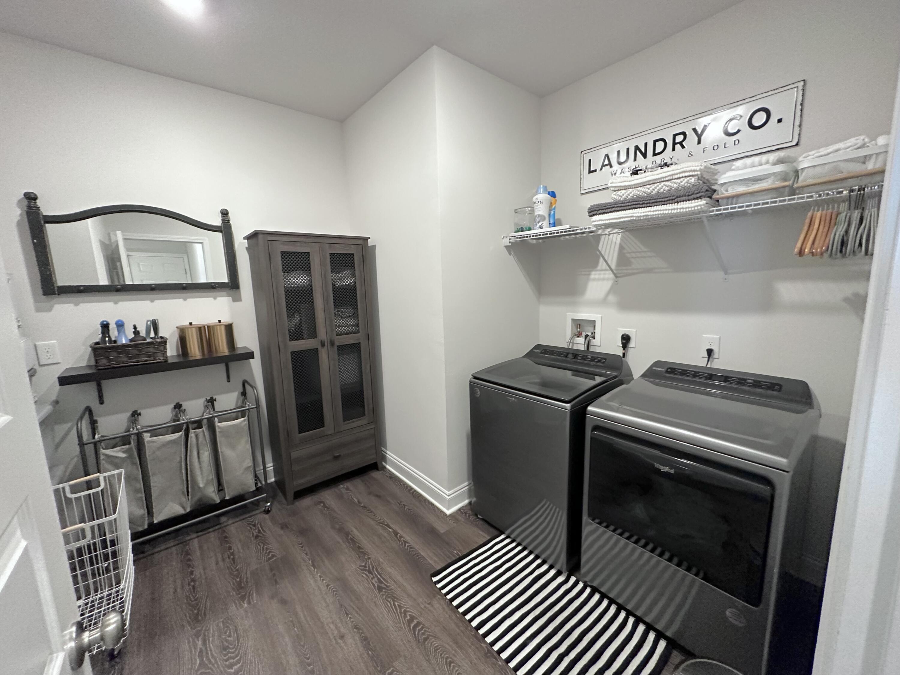 165 Martingale Loop Lynn Haven, FL 32444 - Photo 16 of 37 a kitchen with stainless steel appliances a stove a sink and wooden floor