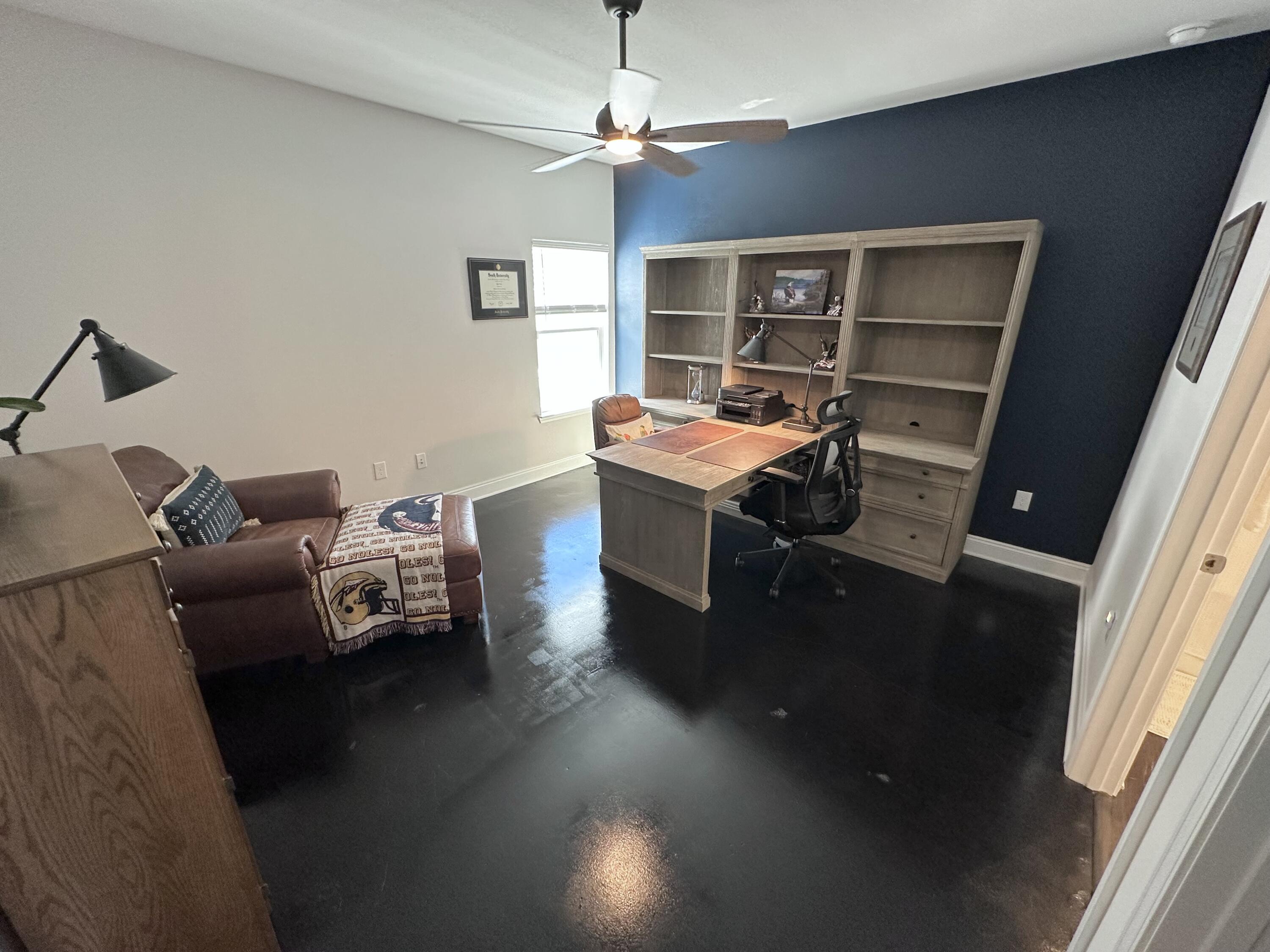 165 Martingale Loop Lynn Haven, FL 32444 - Photo 20 of 37 a living room with a couch and a window