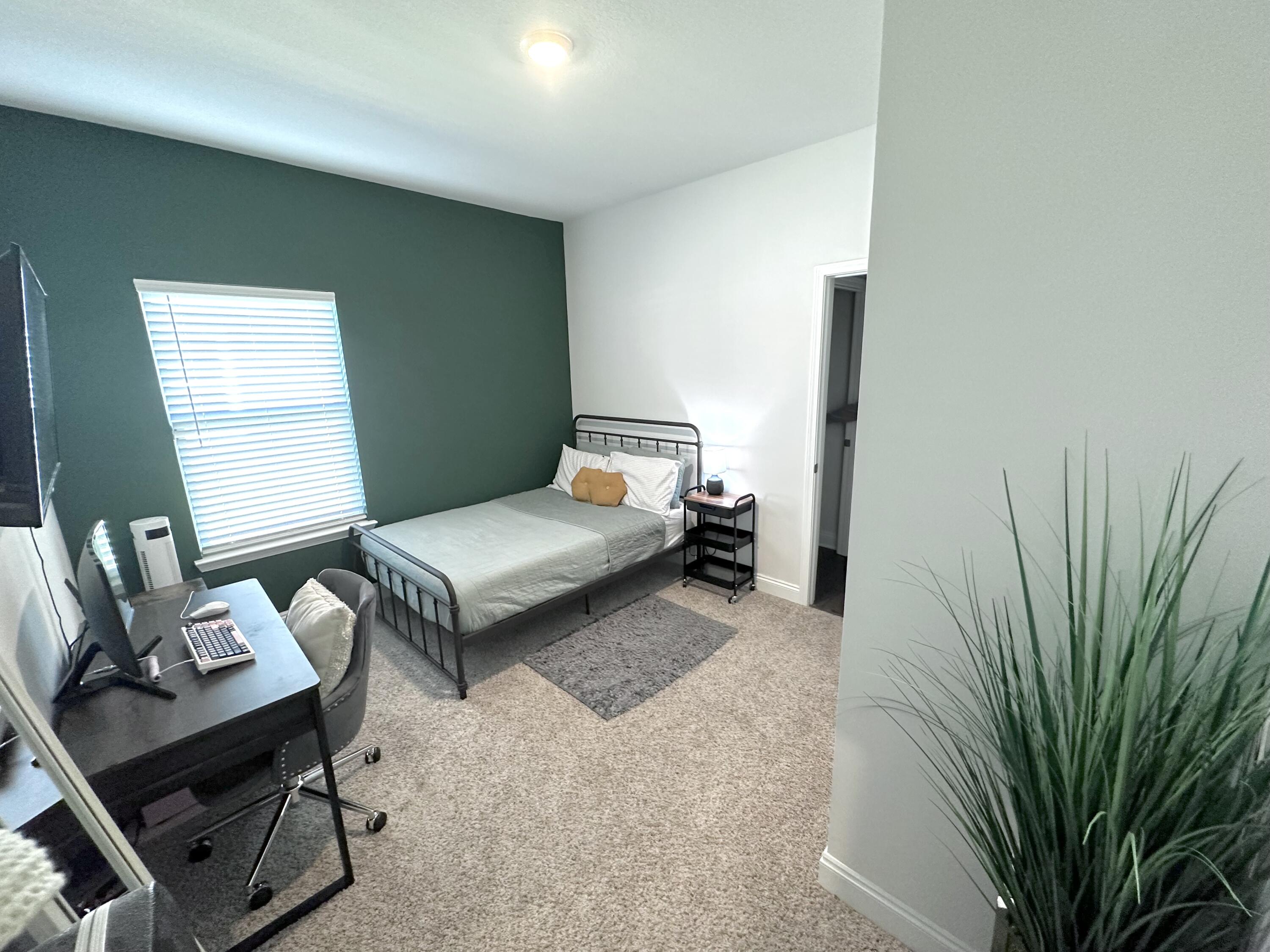 165 Martingale Loop Lynn Haven, FL 32444 - Photo 24 of 37 a bedroom with a bed and furniture