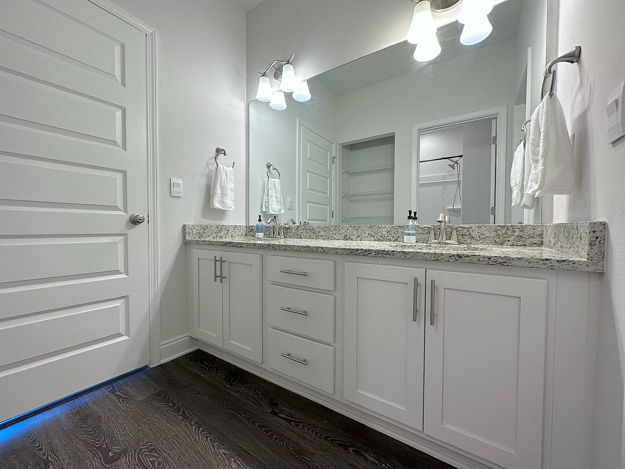 165 Martingale Loop Lynn Haven, FL 32444 - Photo 25 of 37 a bathroom with a sink and a mirror