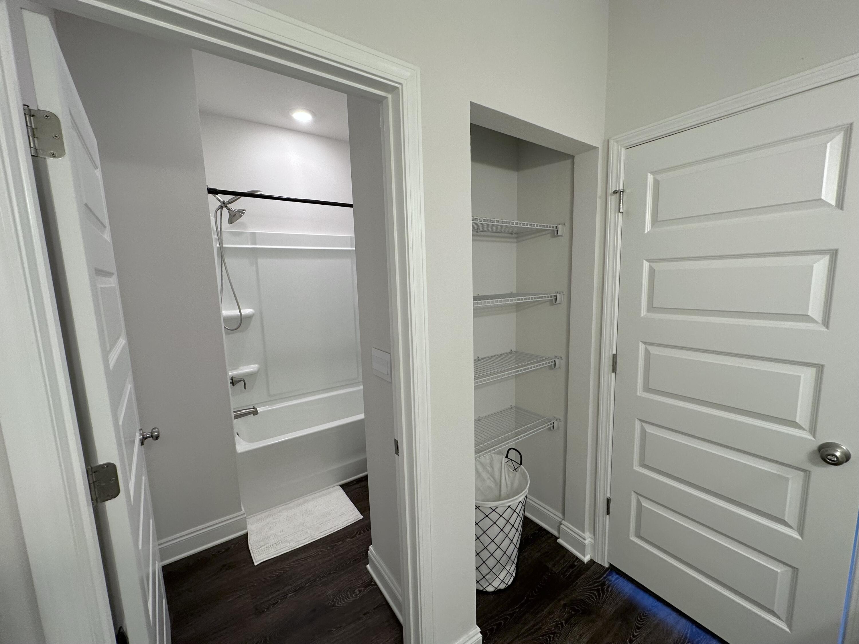 165 Martingale Loop Lynn Haven, FL 32444 - Photo 27 of 37 a bathroom with a tub and shower