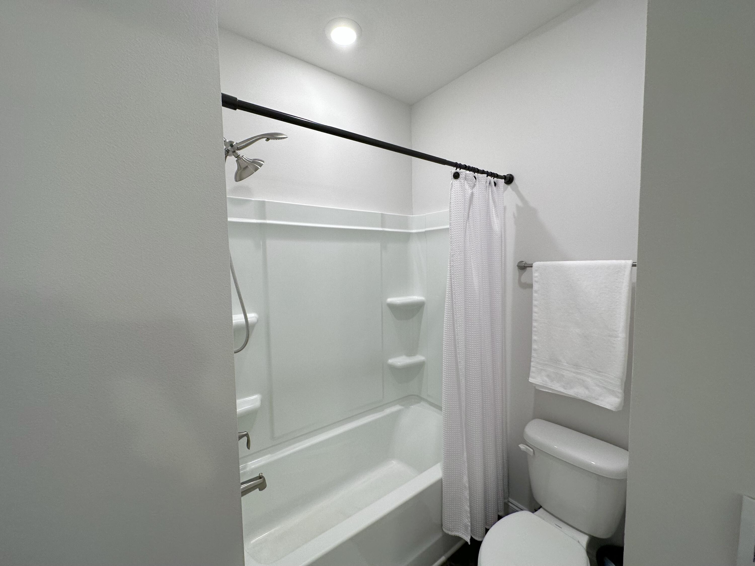165 Martingale Loop Lynn Haven, FL 32444 - Photo 28 of 37 a bathroom with a shower and a toilet