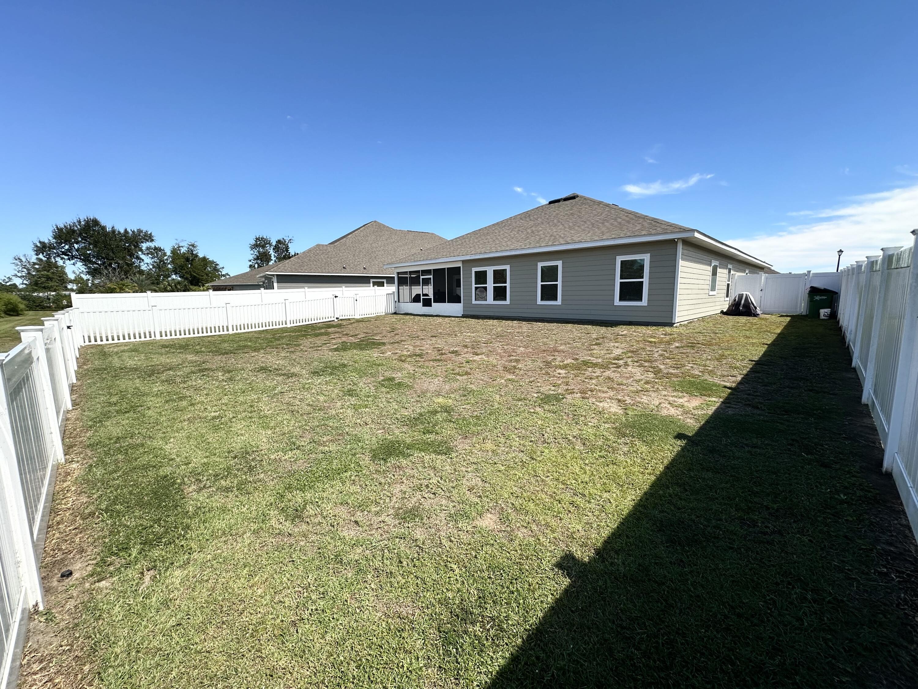 165 Martingale Loop Lynn Haven, FL 32444 - Photo 32 of 37 a view of a house with a yard