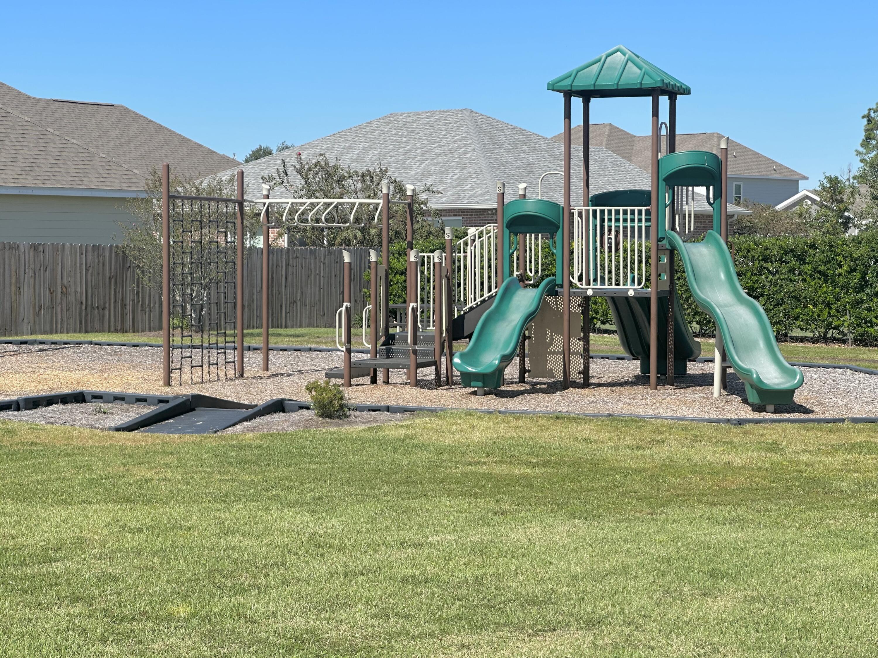 165 Martingale Loop Lynn Haven, FL 32444 - Photo 37 of 37 a view of a house with swimming pool and porch