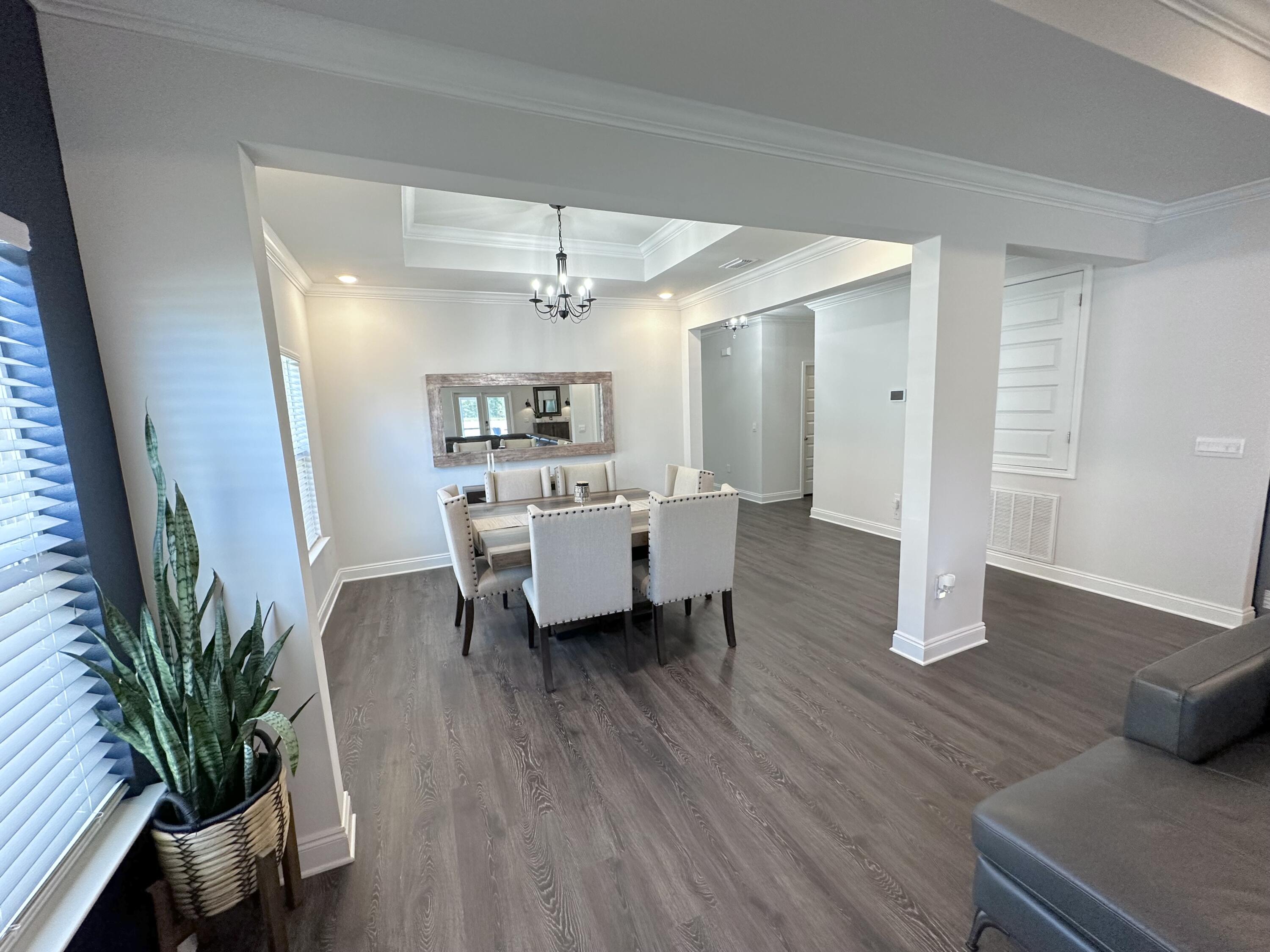 165 Martingale Loop Lynn Haven, FL 32444 - Photo 5 of 37 a living room with furniture and wooden floor