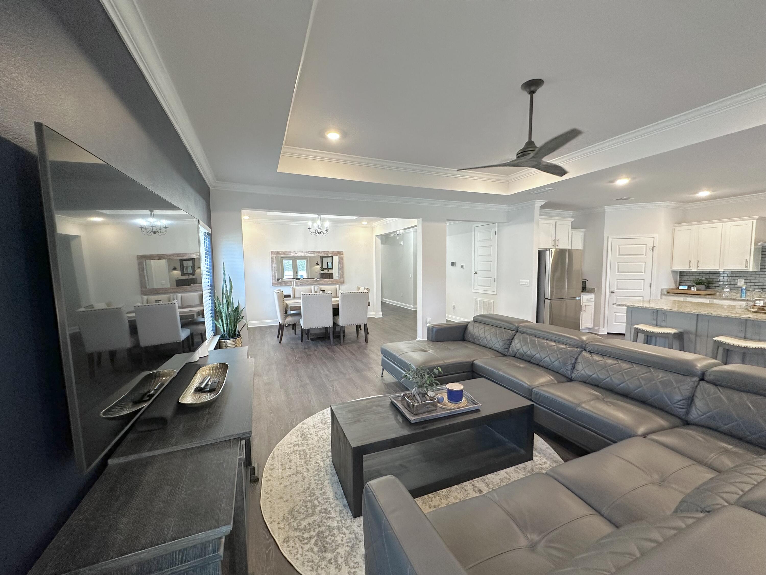 165 Martingale Loop Lynn Haven, FL 32444 - Photo 7 of 37 a living room with furniture and a wooden floor
