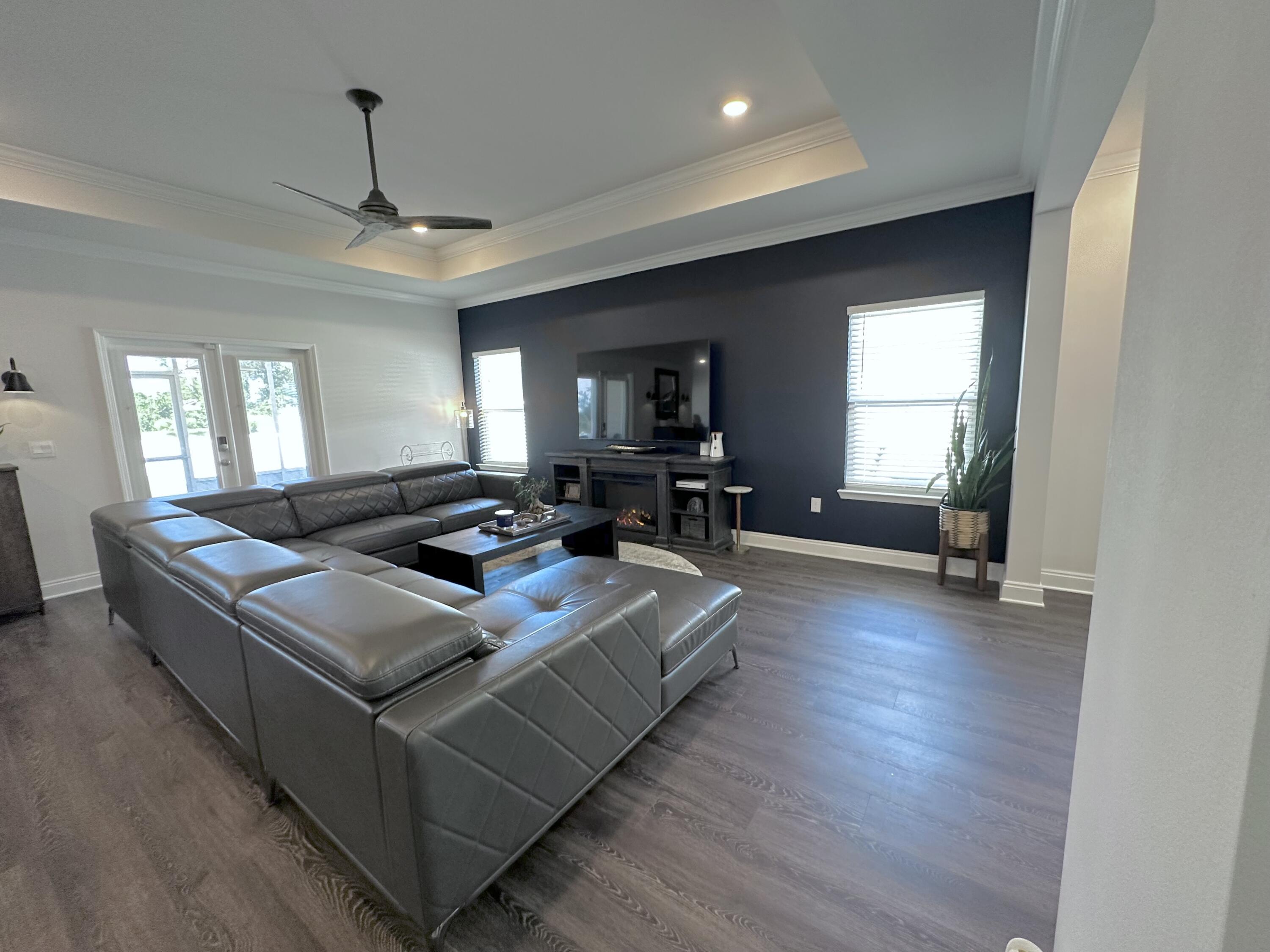 165 Martingale Loop Lynn Haven, FL 32444 - Photo 8 of 37 a living room with furniture flat screen tv and window