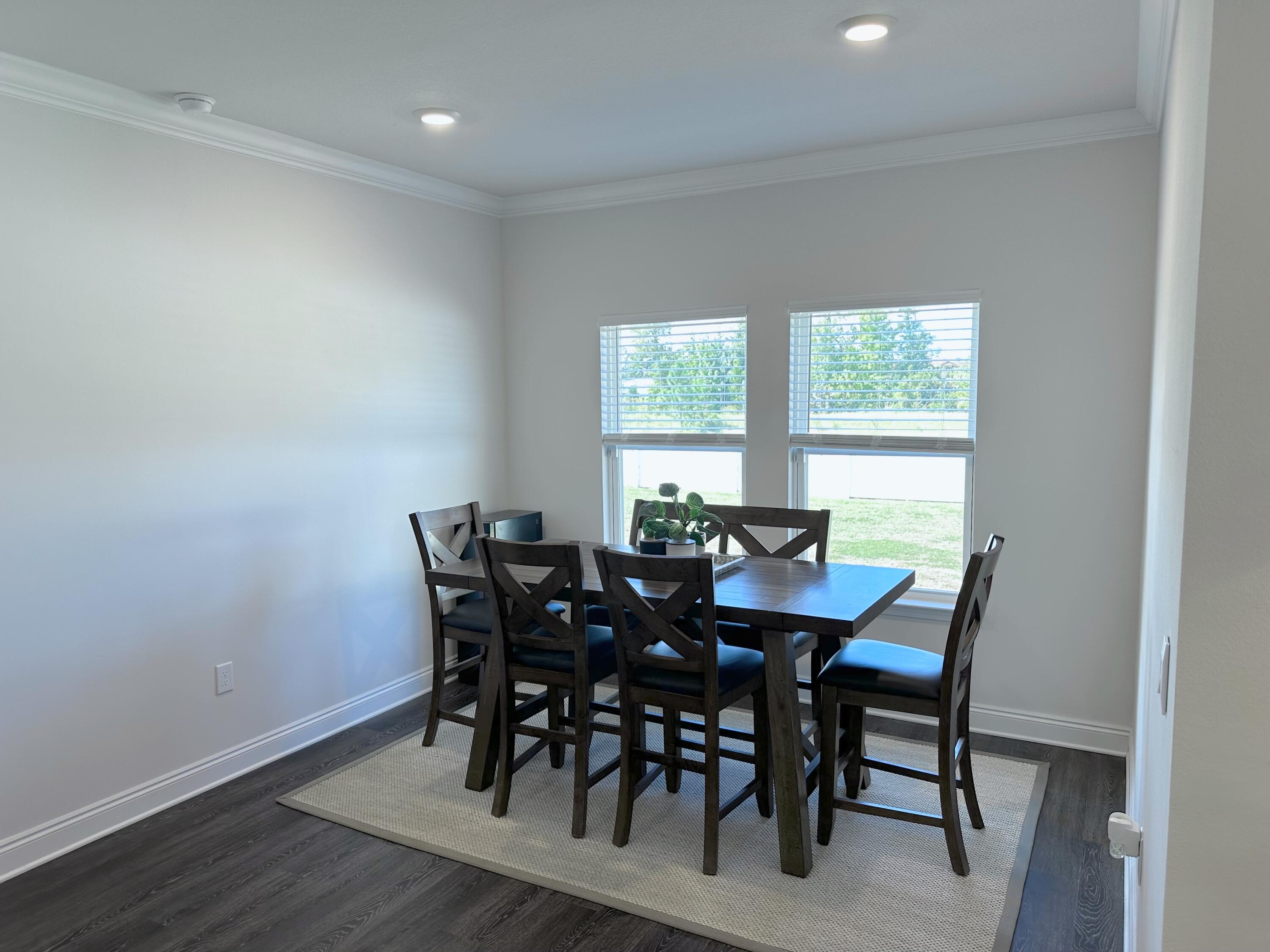 165 Martingale Loop Lynn Haven, FL 32444 - Photo 9 of 37 a view of a dining room with furniture and window