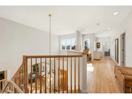 a view of hallway with wooden floor