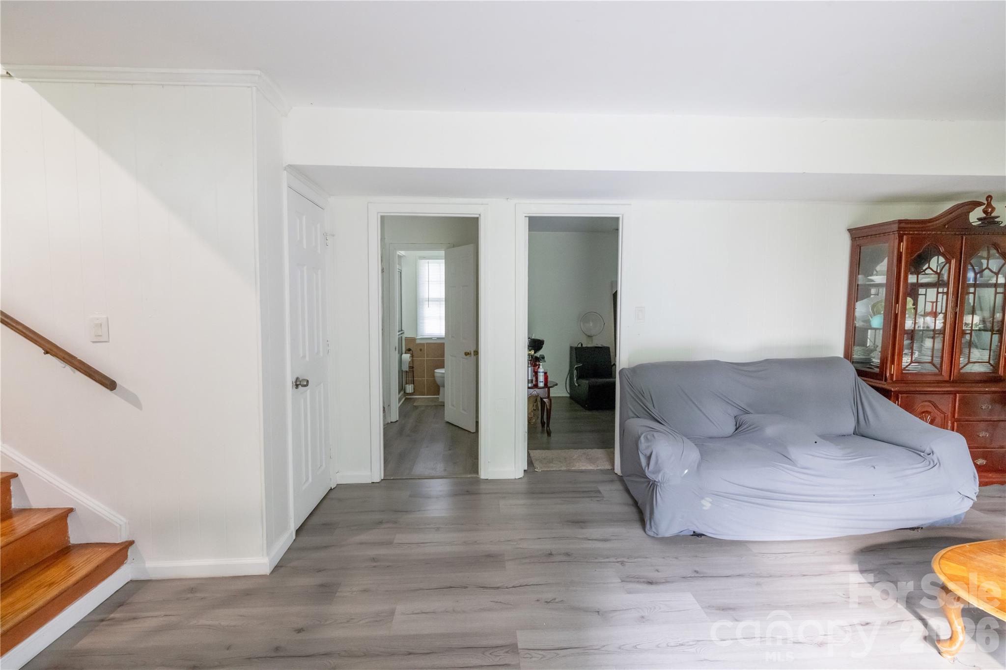 2545 Cedarwild Road Charlotte, NC 28212 - Photo 18 of 25 a living room with furniture and a wooden floor