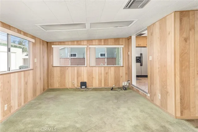a livingroom with furniture and a flat screen tv