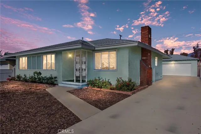 a front view of a house with yard