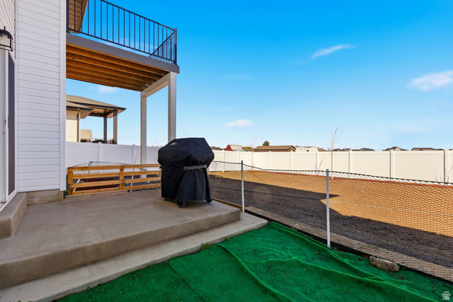 3902 West 825 North West Point, UT 84015 - Photo 31 of 49 Patio / terrace featuring a grill, a fenced backyard, and a patio area