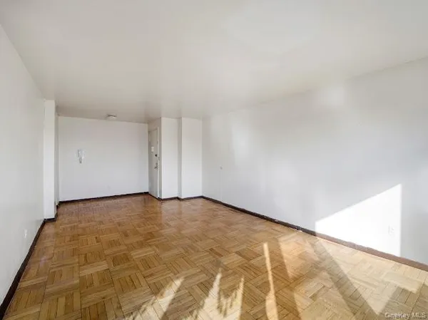 a kitchen with kitchen island a stove a sink and a refrigerator with white cabinets