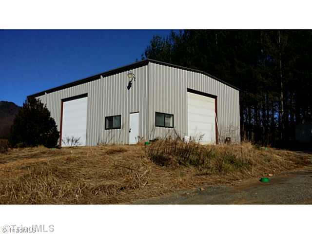 969 Carson Creek Road Lowgap, NC 27024 - Photo 1 of 3 Exterior Front. Nice building with office space and bay doors