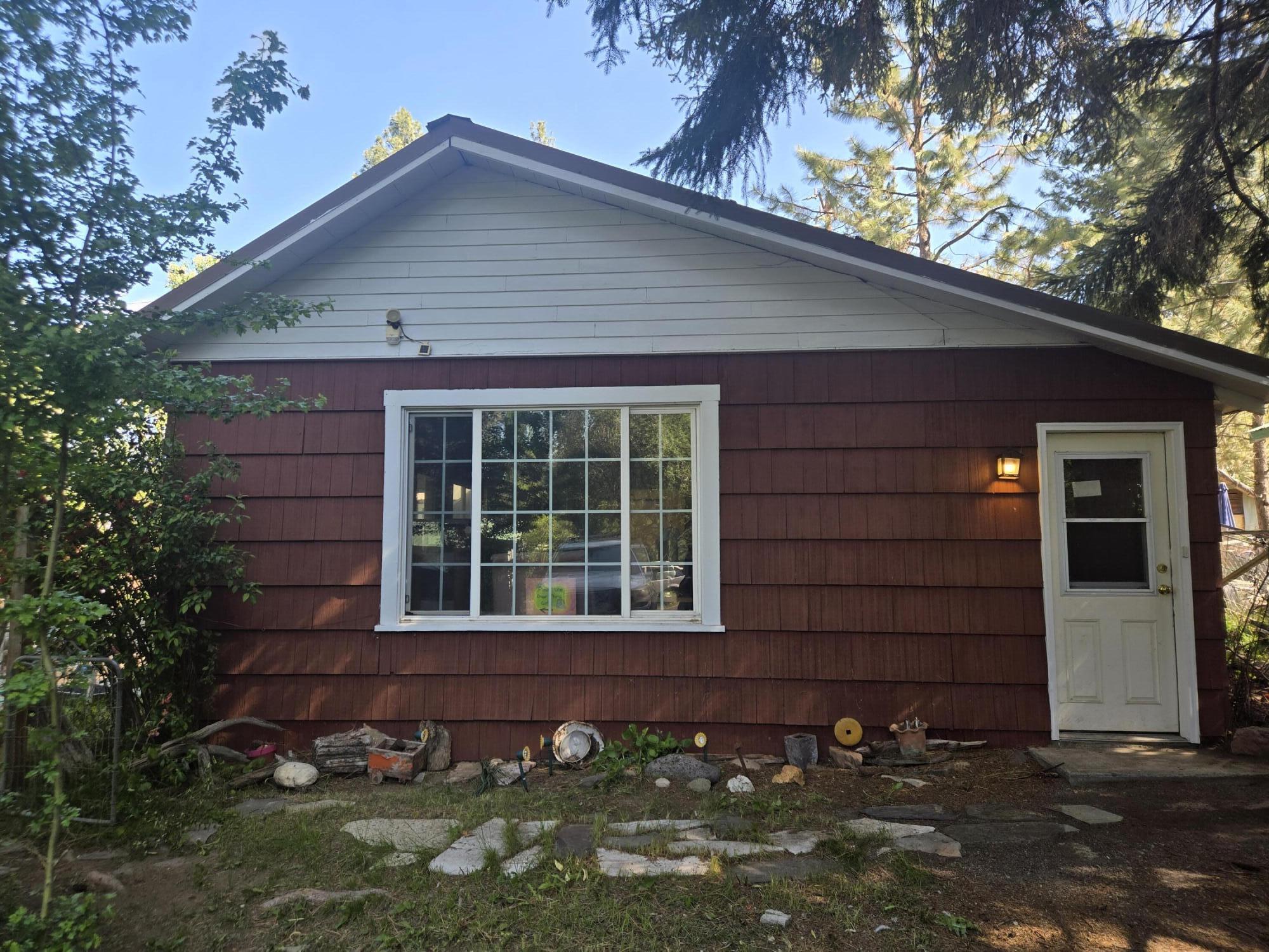 409 East Ash Street Chiloquin, OR 97624 - Photo 1 of 37 a front view of a house with a garage