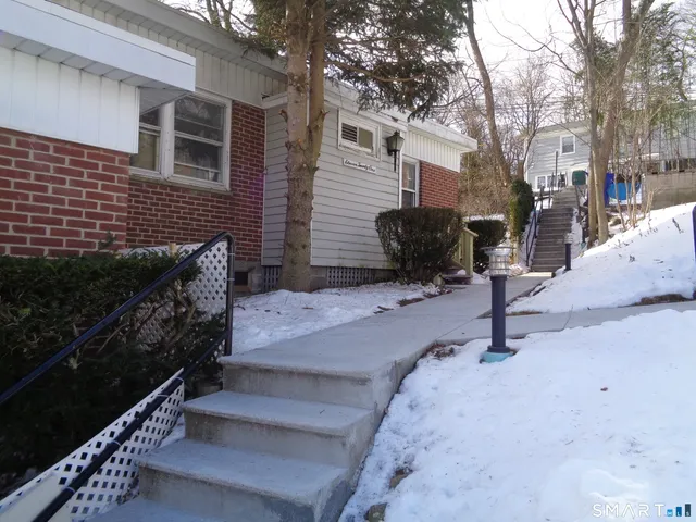 a view of backyard with outdoor seating