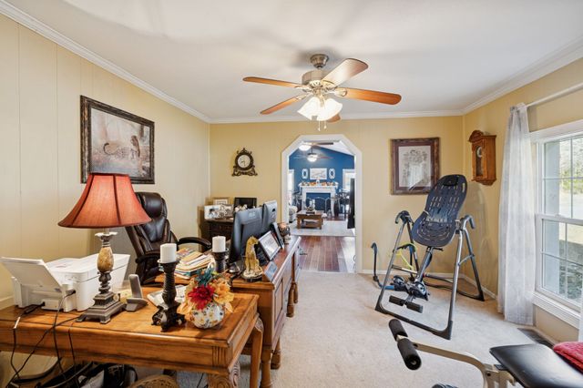 a view of a livingroom with furniture and a flat screen tv