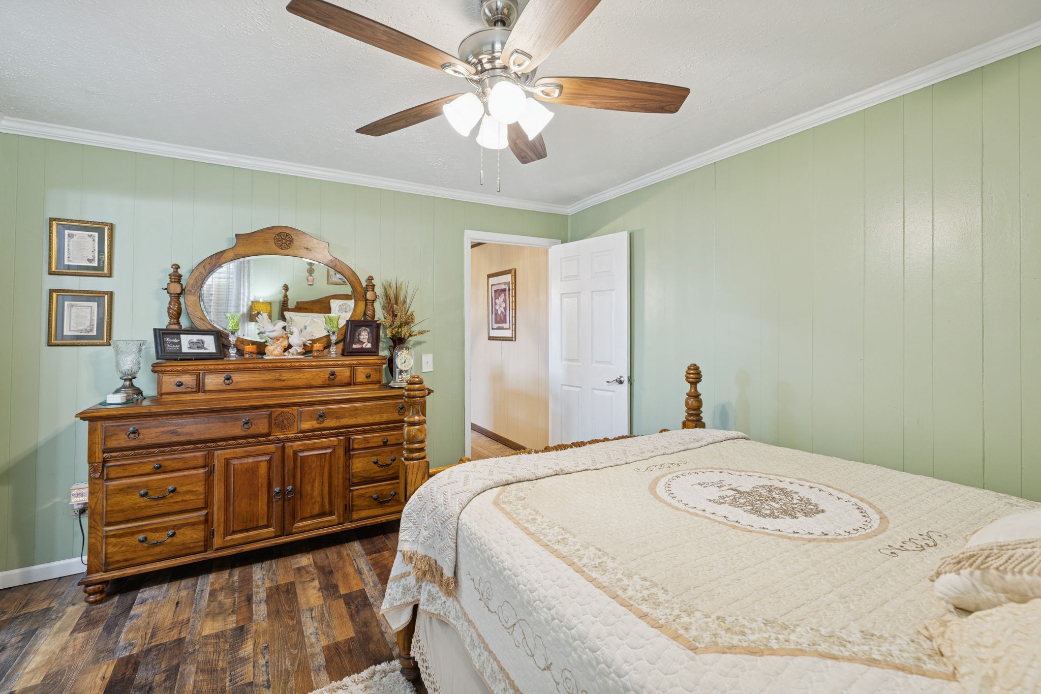 3280 Bethel Road Smithville, TN 37166 - Photo 27 of 35 a bedroom with a bed and a chandelier