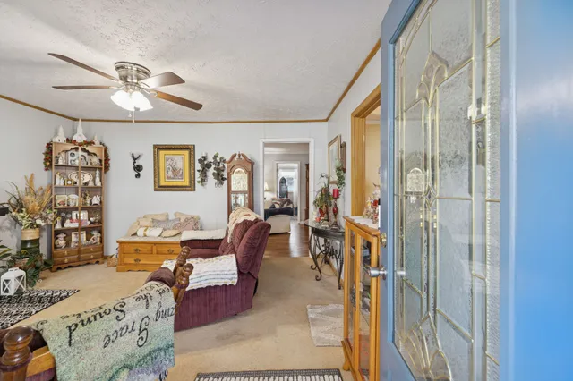 a living room with furniture and a chandelier