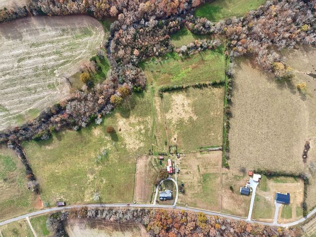 a bathroom with a granite countertop sink and tub