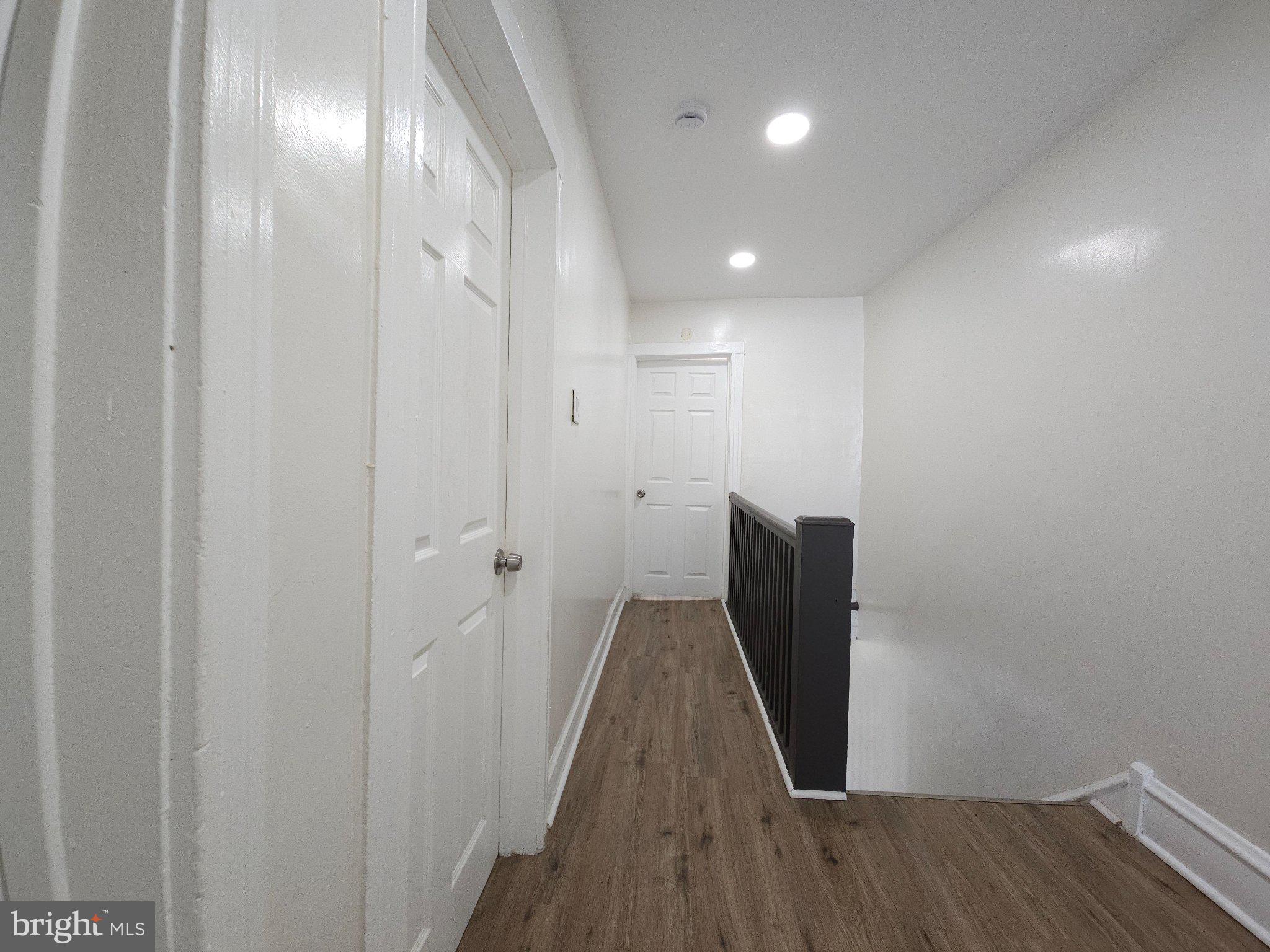 411 South Maple Avenue Lansdowne, PA 19050 - Photo 13 of 18 a view of a hallway with wooden floor