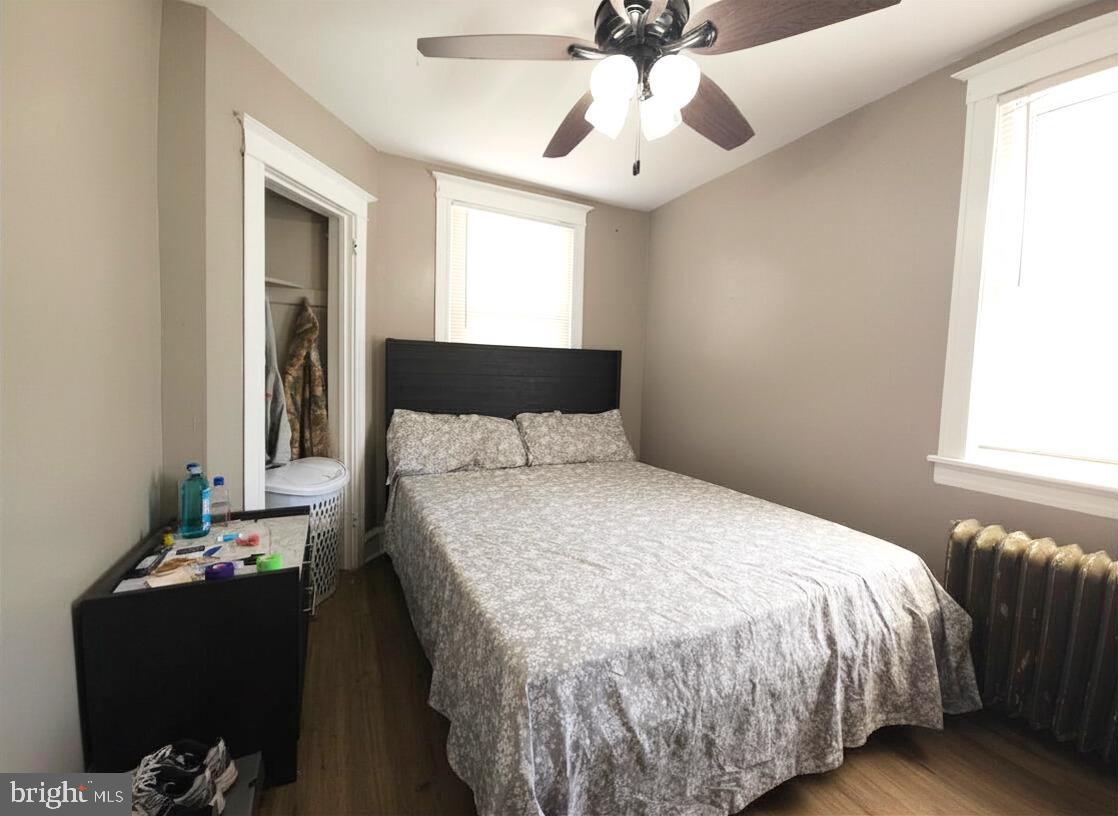 411 South Maple Avenue Lansdowne, PA 19050 - Photo 14 of 18 a bedroom with a bed and a chandelier