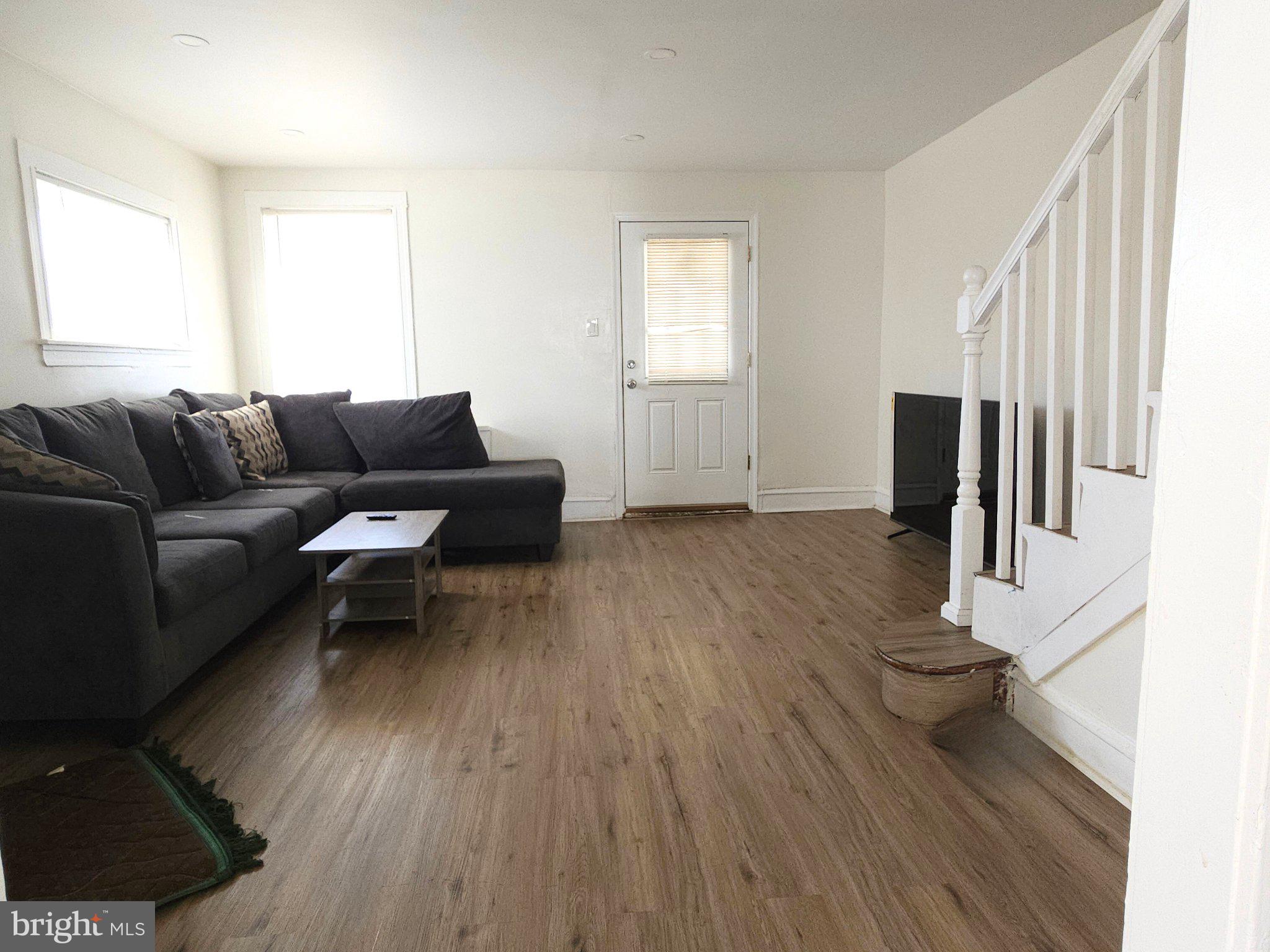 411 South Maple Avenue Lansdowne, PA 19050 - Photo 6 of 18 a living room with furniture and a wooden floor