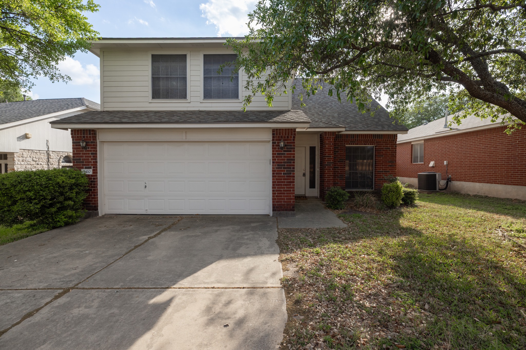 3410 Flowstone Lane Round Rock, TX 78681 - Photo 3 of 38 Charming two-story home with a two-car garage, mature tree in the front yard, and a welcoming entryway. Located in a quiet residential neighborhood.