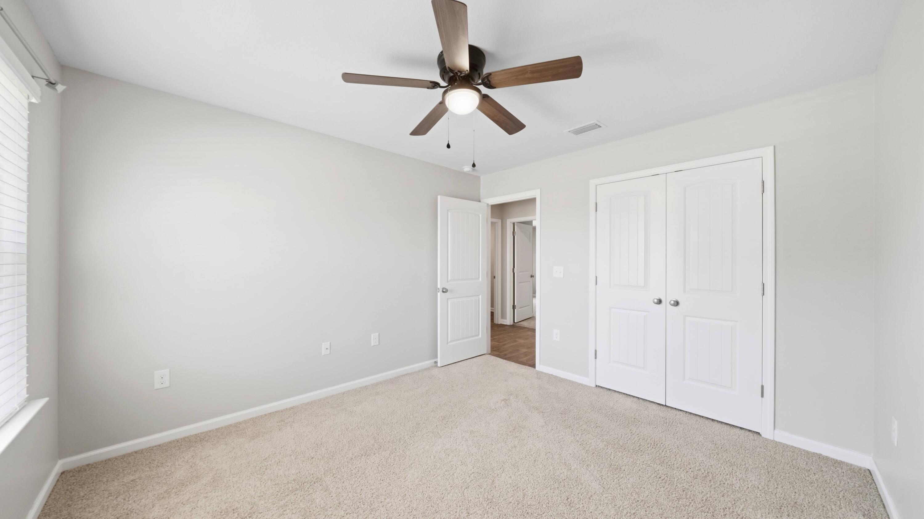 3927 Alva Thomas Road Panama City, FL 32404 - Photo 20 of 46 a view of a chandelier fan in a room