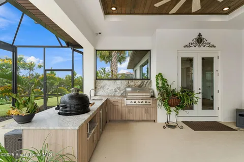 a living room with furniture and a baby crib