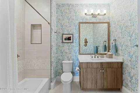 a view of a porch with furniture and garden