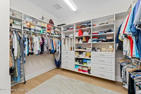 a living room with lots of furniture and a chandelier