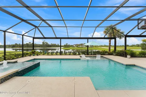 a dining room with furniture and chandelier