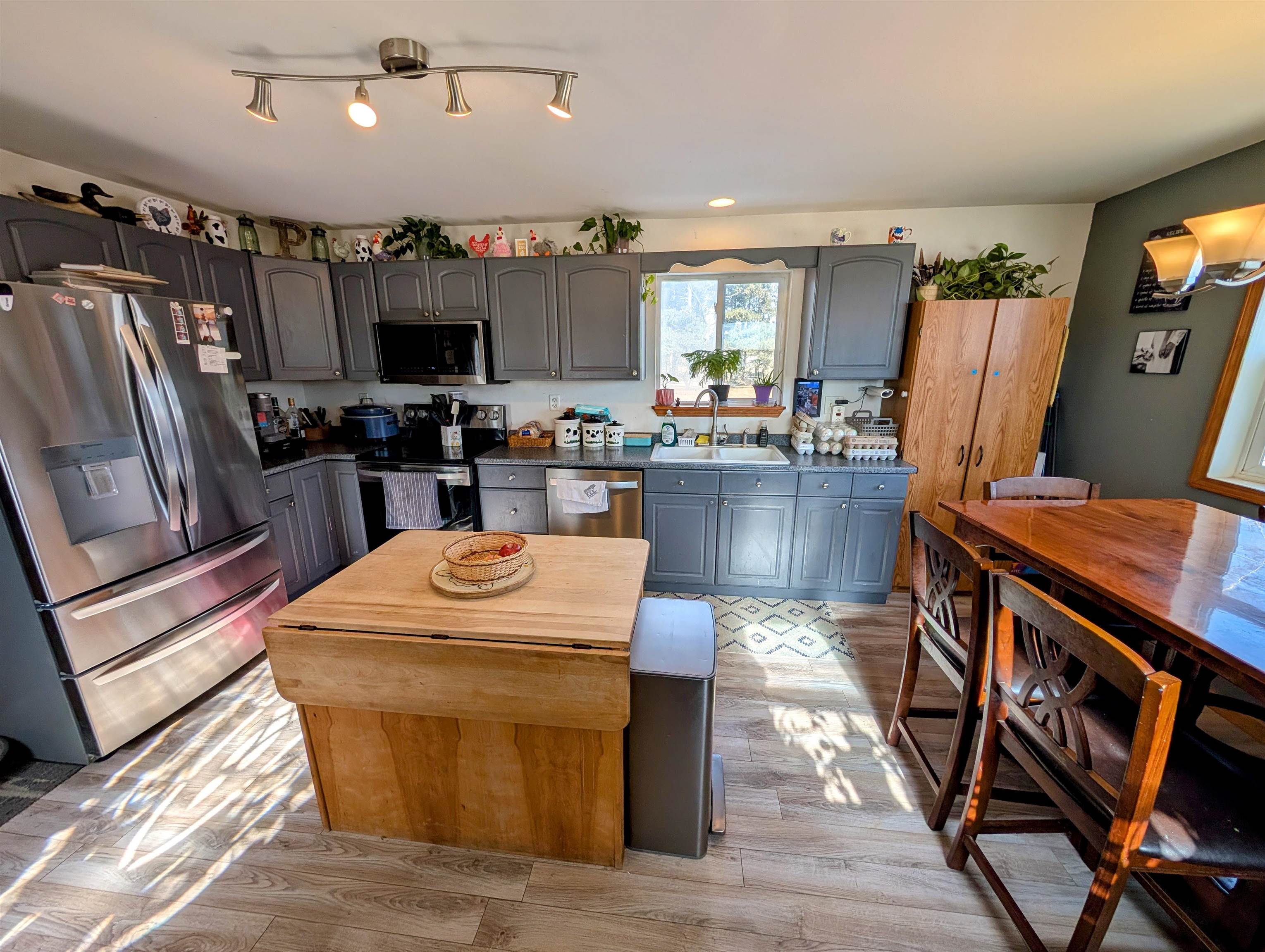23087 Burr Oak Road Harvard, IL 60033 - Photo 5 of 40 a kitchen with sink refrigerator and microwave