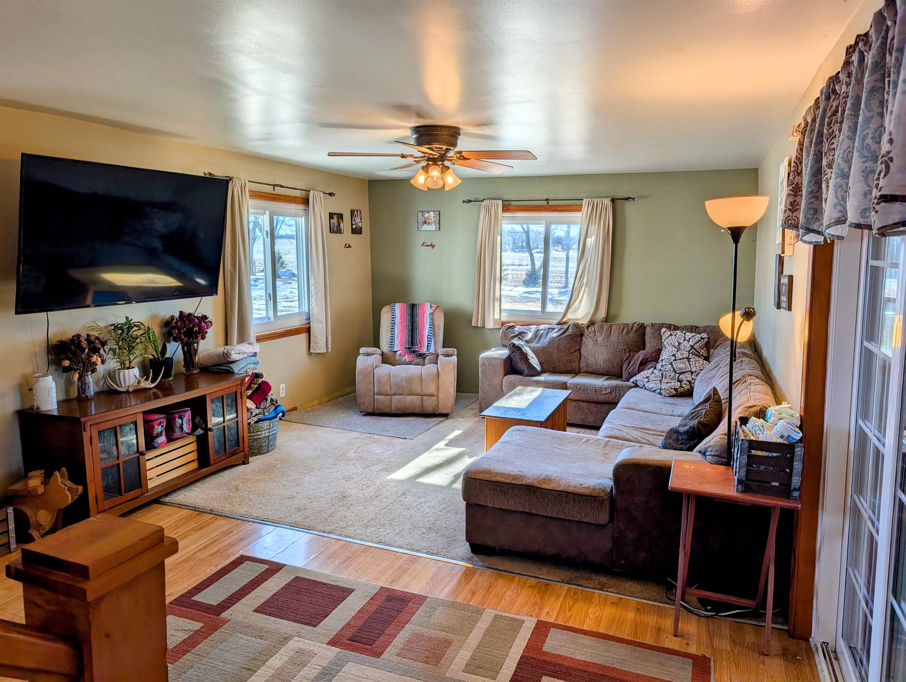 23087 Burr Oak Road Harvard, IL 60033 - Photo 7 of 40 a living room with furniture and a flat screen tv
