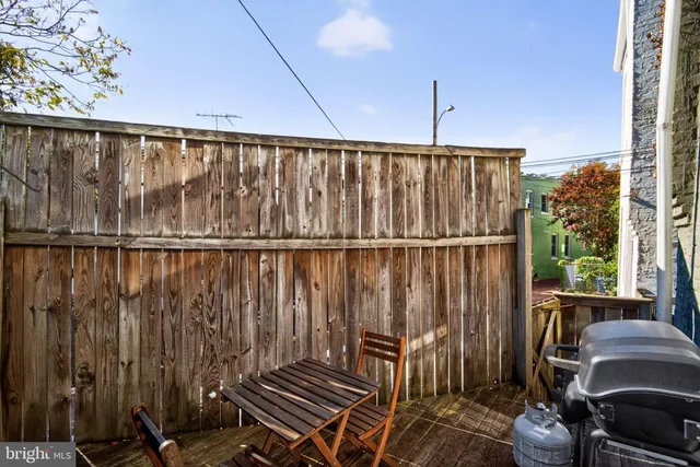 a balcony with wooden floor