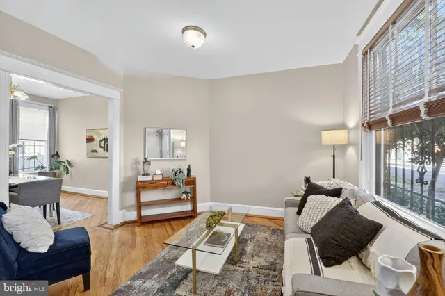 a living room with furniture and a table