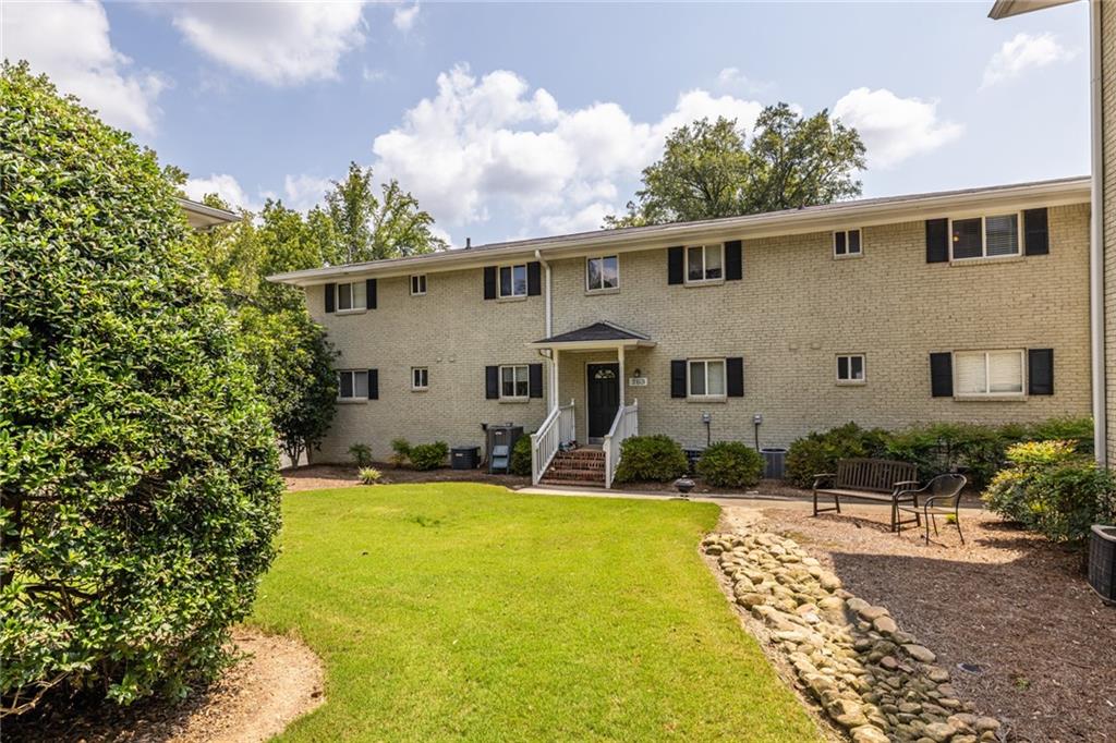 a view of a house with a backyard