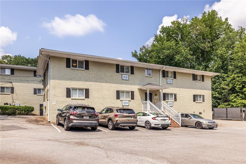 263 Jefferson Place, Unit 31 Decatur, GA 30030 - Photo 18 of 27 a car parked in front of a house