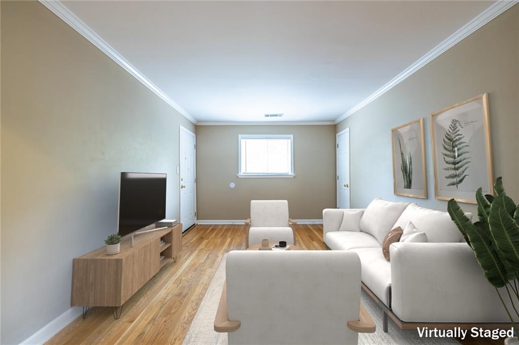 263 Jefferson Place, Unit 31 Decatur, GA 30030 - Photo 3 of 27 a living room with furniture and a flat screen tv