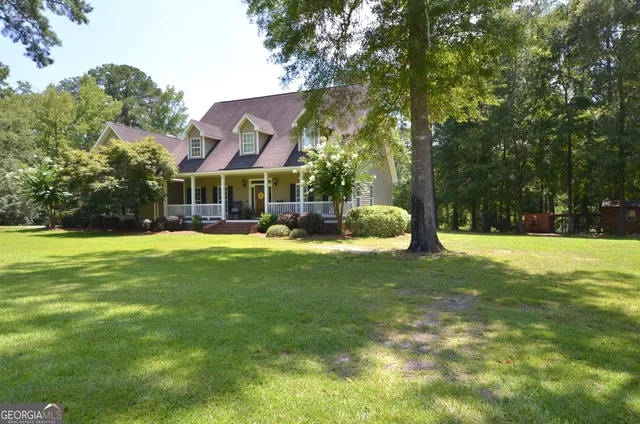 a view of a house with a big yard
