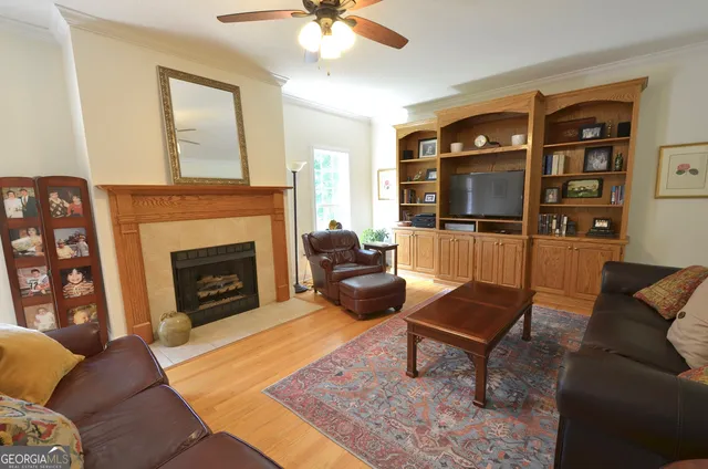 a living room with furniture and a fireplace