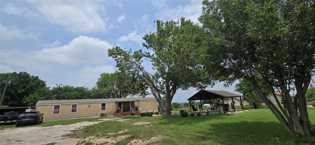 9212 Thaxton Road Austin, TX 78747 - Photo 2 of 10 View of front of property with a gazebo and a front lawn