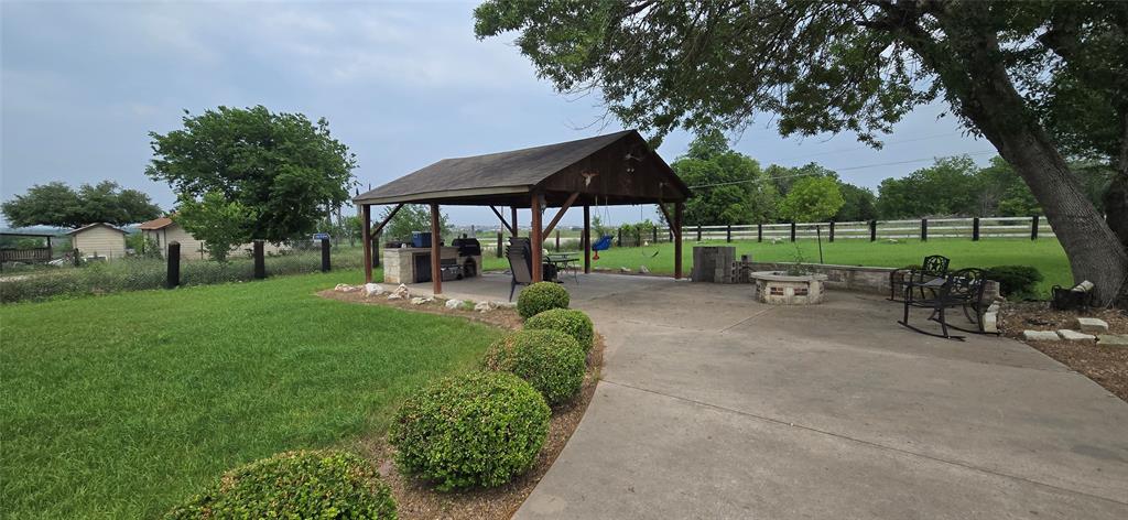 9212 Thaxton Road Austin, TX 78747 - Photo 6 of 10 Surrounding community with a gazebo and a patio