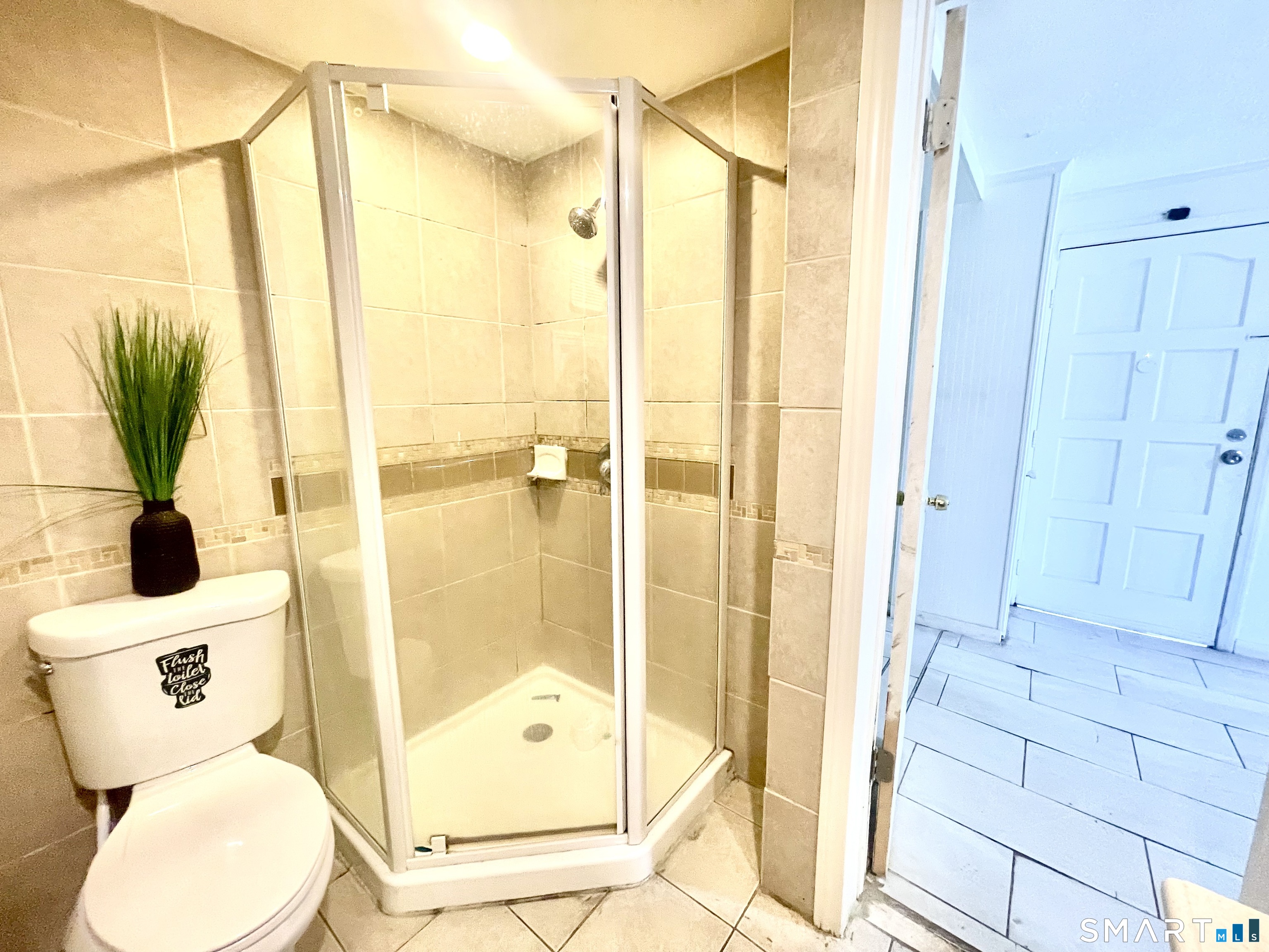 128 Franklin Street Waterbury, CT 06706 - Photo 11 of 25 a bathroom with a shower toilet and sink